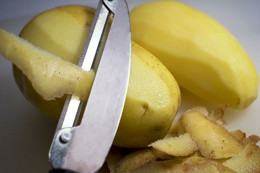 Peeling Potatoes Skins with a Peeler during Food Preparation