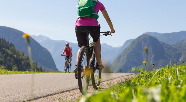 Active sporty woman riding mountain bike in the nature, Slovenia.