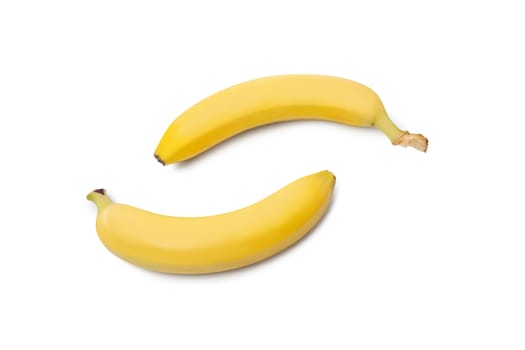 A close up of a couple of light yellow bananas isolated on white background. Refreshing and organic appetizing bananas. With Clipping Path