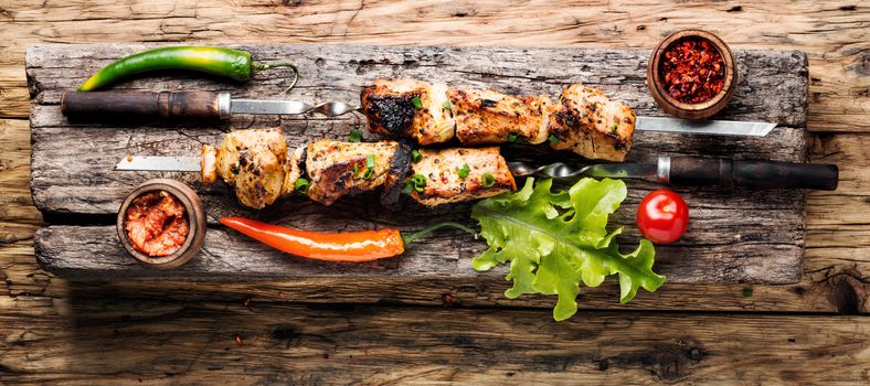 Grilled shish kebab or shashlik on skewers.Eastern food.Shish kebab on a stick
