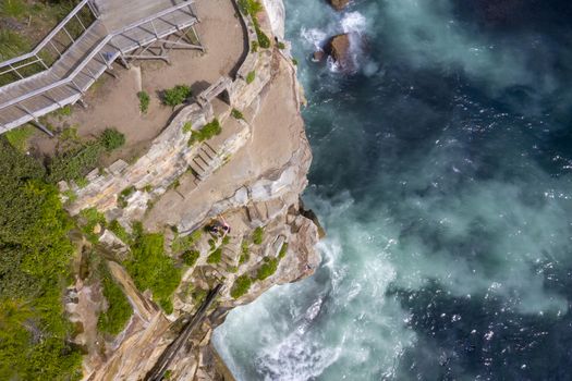 Aerial top down views of the steps hewn into the cliff face of Sydney's escarpment headland of the Eastern suburbs