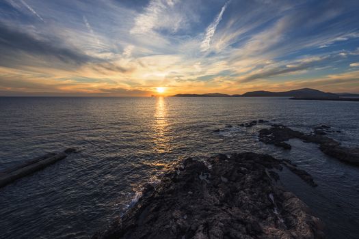 beautiful sunset on the giant that sleeps in the Gulf of Alghero, Sardinia, Italy