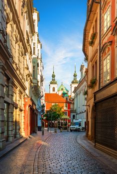 Old narrow street of Prague at dawn