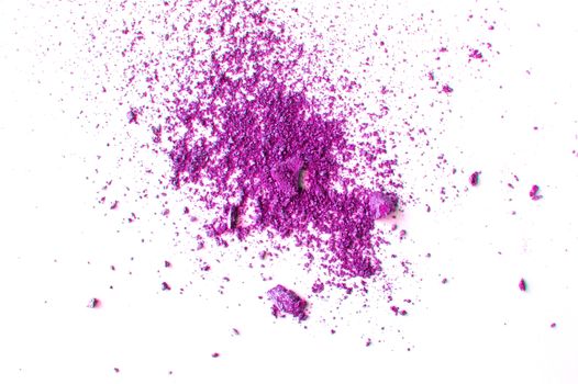 Lilac or purple eyeshadow, scattered crumbs isolated on white background, beauty and makeup concept.