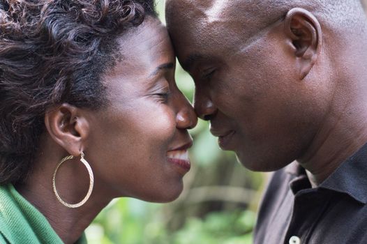 closeup of a romantic couple standing face to face and embracing in campaign.