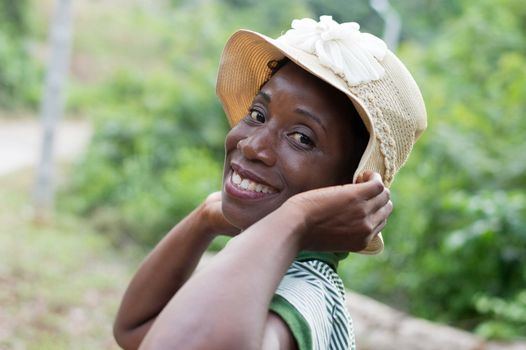 portrait of beautiful smiling woman on a walk in the bush.