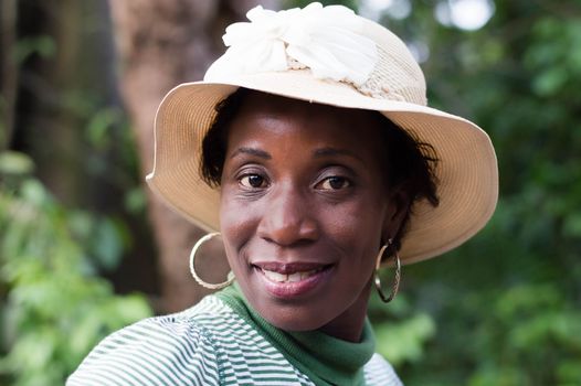 portrait of beautiful smiling woman on a walk in the bush.