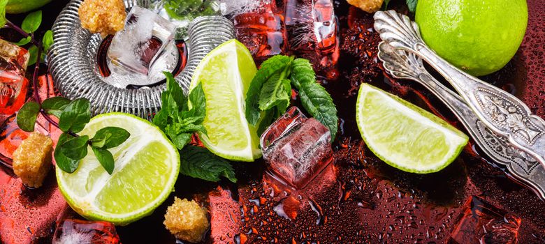 Mint, lime, ice ingredients and bar utensils