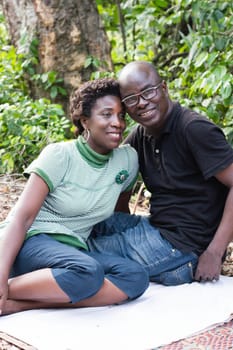 young happy couple on a summer vacation in a country park.