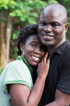 happy young couple embracing in countryside.