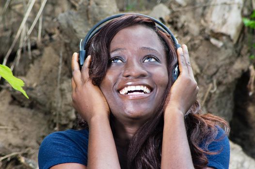happy young woman listening to good music with headphones.