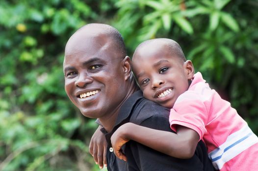 father and son are happy to walk together quietly in the countryside.