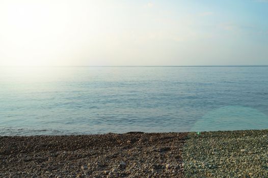 Calm sea ocean and blue sky background, sunrise over the sea, beautiful background.