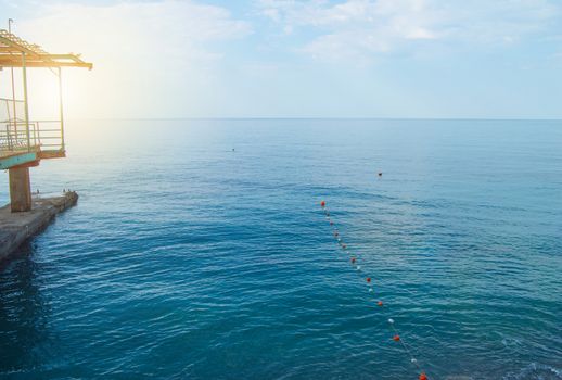 Separation buoys in the sea for safe swimming on the beach.