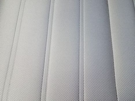 grey upholstery or fabric on seat or chair or background