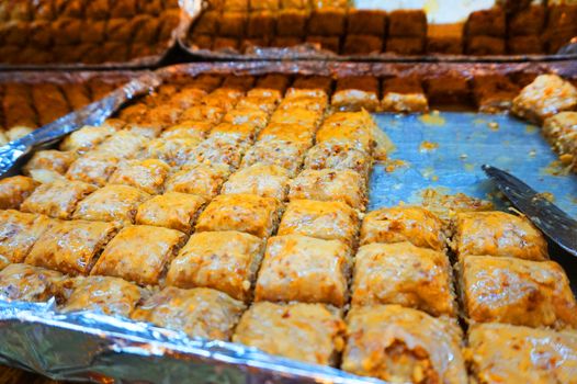Traditional Arabic dessert-baklava, the concept of celebrating the Holy month of Ramadan and Eid al-Fitr, food background, sweet food.