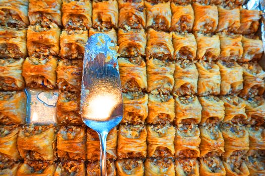 Traditional Arabic dessert-baklava, the concept of celebrating the Holy month of Ramadan and Eid al-Fitr, food background, sweet food.