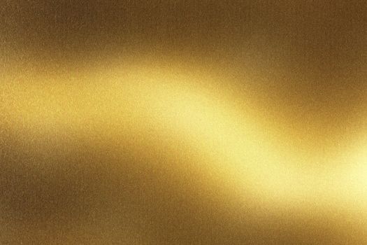 Glowing brushed gold metal wall surface, abstract texture background