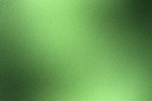 Glowing rough green metal wall surface, abstract texture background