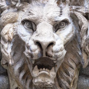 Italy, Turin. Made of stone and located on a marble arch, aroud 300 years old. Fallen angel in the shape of a roaring lion.
