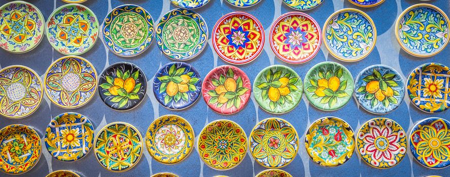 Souvenir from Sicily: fridge magnets with colourful design. Useful for background.