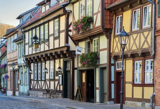 the street with half-timbered houses in Quedlinburg, Germany. In downtown a wide selection of half-timbered buildings from at least five different centuries are to be found