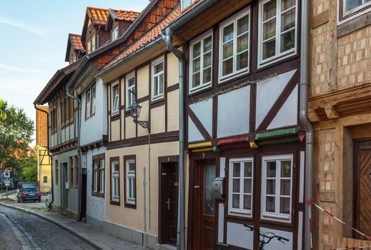 the street with half-timbered houses in Quedlinburg, Germany. In downtown a wide selection of half-timbered buildings from at least five different centuries are to be found
