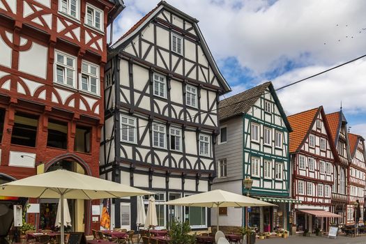 the street with picturesque ancient half-timbered houses in the Fritzlar city, Germany