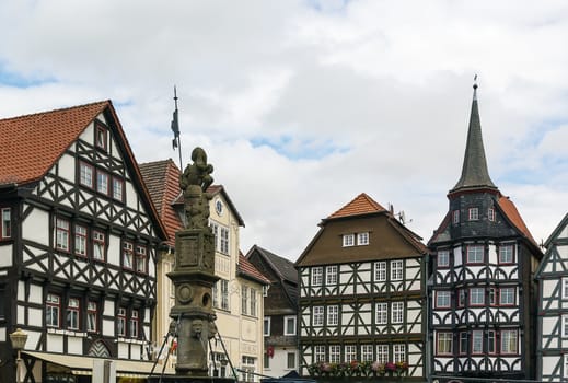 the street with picturesque ancient half-timbered houses in the Fritzlar city, Germany