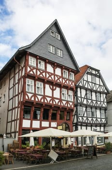 the street with picturesque ancient half-timbered houses in the Fritzlar city, Germany