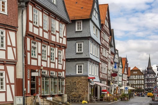 the street with picturesque ancient half-timbered houses in the Fritzlar city, Germany