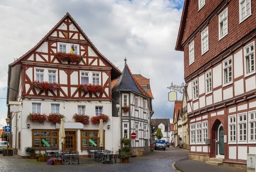 the street with picturesque ancient half-timbered houses in the Fritzlar city, Germany