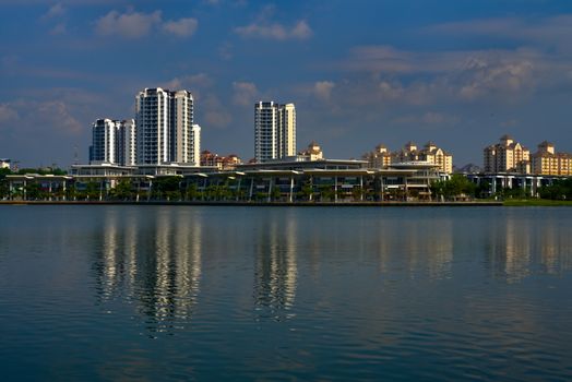 Putrajaya lake with residential area and skyscrapers