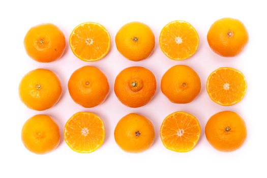 Top view of round cut slices of ripe juicy organic mandarin oranges on a white background. Vitamins healthy lifestyle vegan super foods concept.