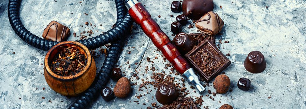 Oriental smoking hookah with a taste of chocolates. Chocolate tobacco flavor.Summer party,