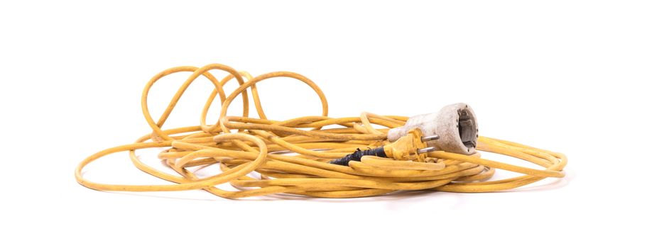 Extension cord, old and probably not safe anymore - Isolated on white