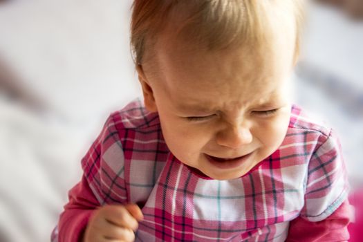 crying unhappy little child. little girl is flooding with tears