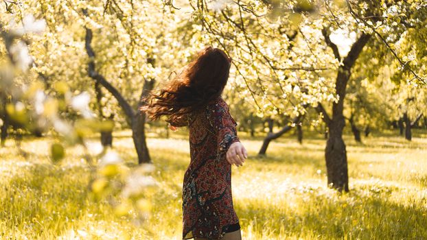 Beautiful Young Woman Outdoor. Enjoy Nature. Healthy Smiling Girl in the Spring Park. Sunny day