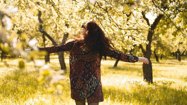 Beautiful Young Woman Outdoor. Enjoy Nature. Healthy Smiling Girl in the Spring Park. Sunny day