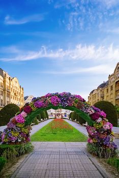 Flower arch on the Victory Square (Piata Libertatii) in Timisoara, Romania