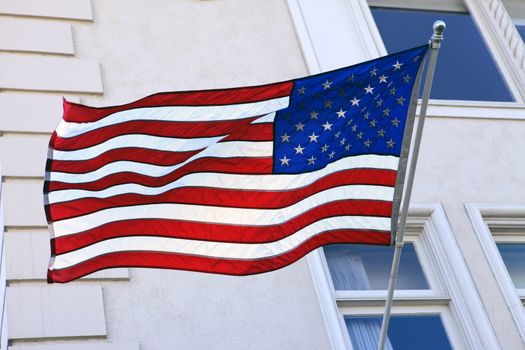 USA Flag on pole waving in the wind