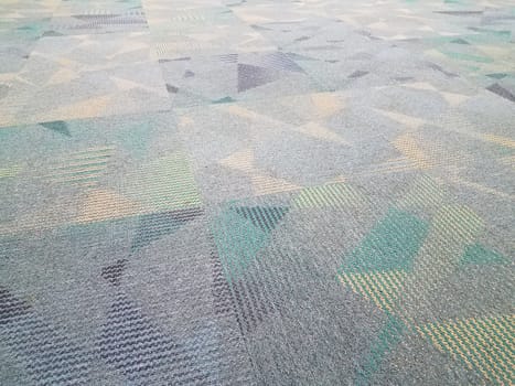 blue and grey carpet or rug with triangles and colors