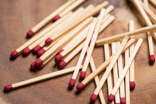 Matches on wooden table background.