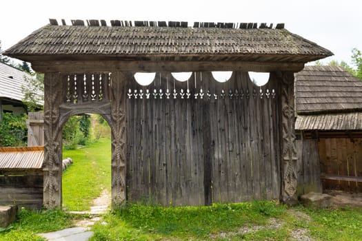 Traditional handmade wooden carved gate from Maramures region in northern Romania.