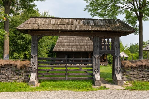 Traditional handmade wooden carved gate from Maramures region in northern Romania.