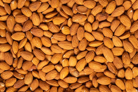 Food texture background of big raw peeled almonds , top view.