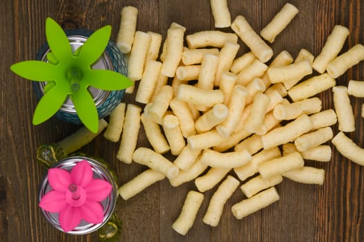 Corn puffs snack food texture background, close up detail.