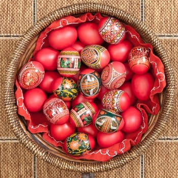 Set of Easter eggs painted in traditional Eastern European style with a floral/geometric design in a bowl.