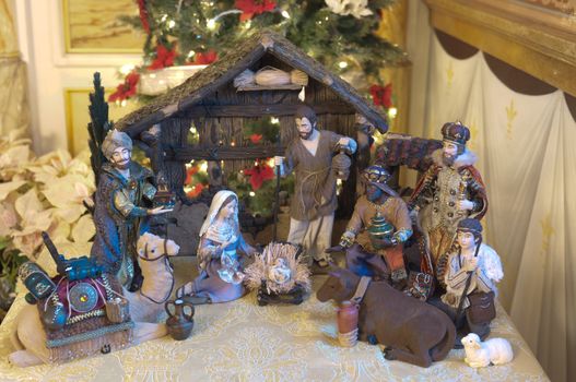 Christmas Nativity Scene with Three Wise Men Presenting Gifts to Baby Jesus, Holy Mary and Joseph.