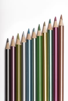 Set of metallic colored pencils isolated on a white background.